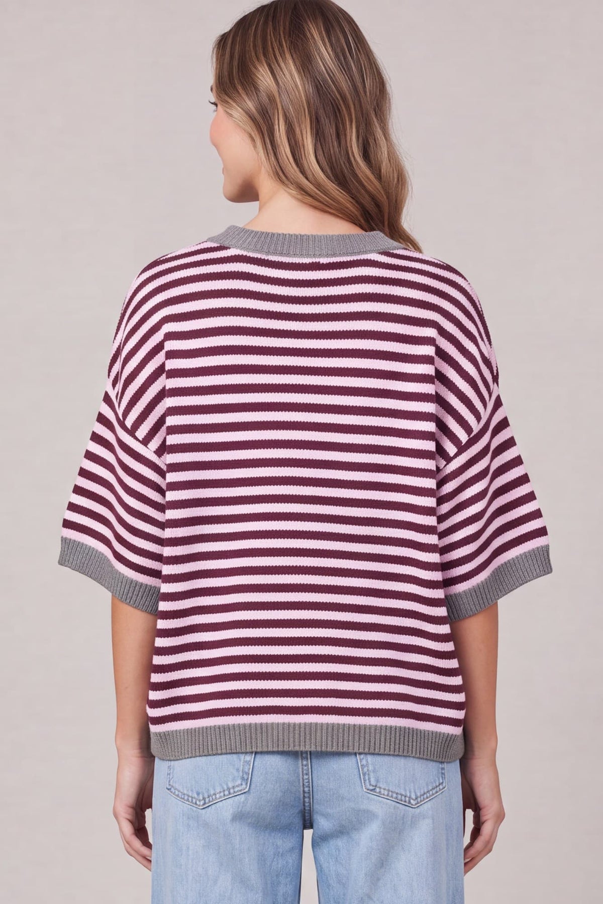 Garnet and pink striped sweater detail